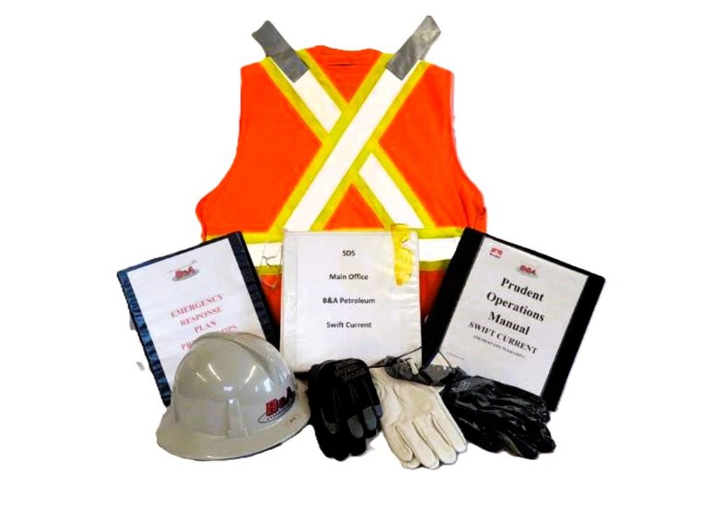 Safety gear and manuals on a white background